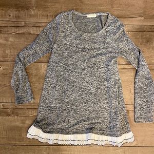 Tunic length sweater with white trim from boutique